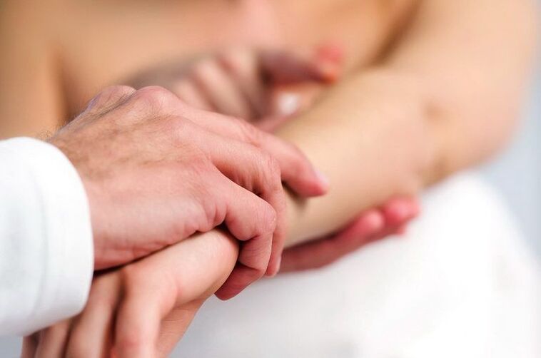 Dermatologist examines a patient with psoriasis